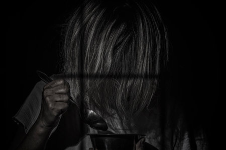 the girl behind the bars,black backgroundの写真素材