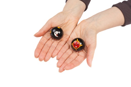 Baoding balls in a female hands isolated on white backgroundの写真素材