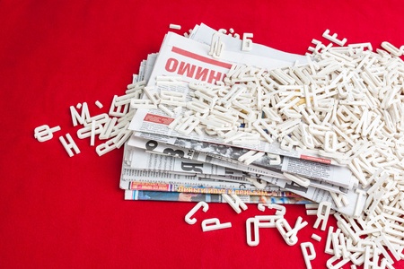 Dimensional letters scattered papers on a red velvet backgroundの写真素材