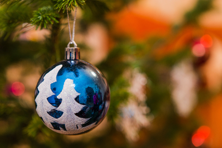 The girl decorates a fir-tree with house toysの写真素材