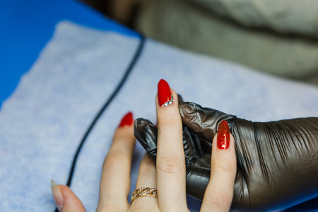 Beautiful manicure and natural nails with gel polish. Attractive modern nail art design.の写真素材