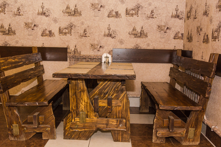Interior of a wooden ancient table. A table at restaurant from a treeの写真素材