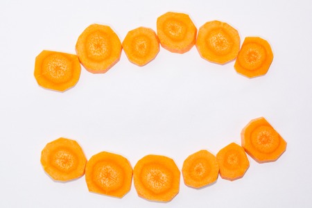 Carrots on a white background. The peeled carrots. The cut carrots.の写真素材