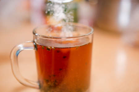 Tea in a bowl. Fresh tea. The invigorating drink. Green tea, Black tea.の写真素材