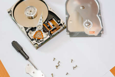 To disassemble a hard drive. To repair a chip or the chip.の写真素材