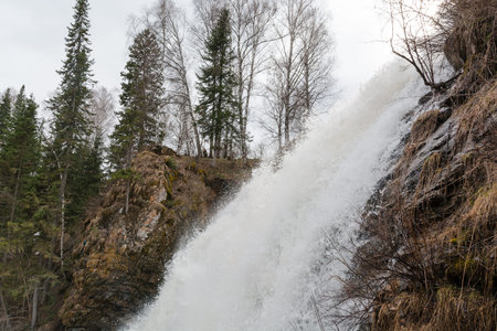 Mountain waterfall. Water flows from the rock. Water falls from the rocky area down.