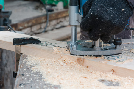 milling-machine wood. The man mills a tree. wood carvingの写真素材