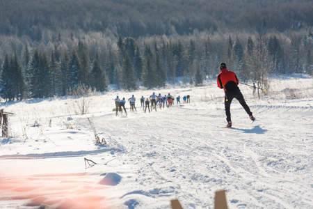 Group of skiers slide from the mountain. The skier to slide on the mountain. Skier and skis. Winter entertainments on skisの写真素材
