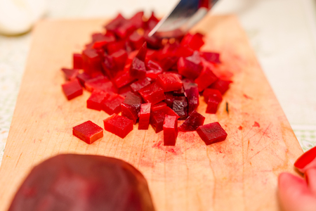 To cut beet. The beet cut on segments. Beet for salad.の写真素材