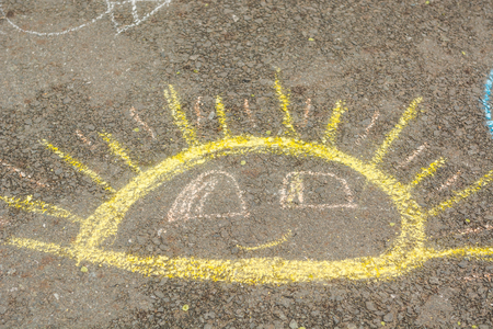 Children's drawings on the road. Chalk drawings on the asphalt.の写真素材