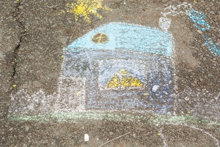 Children's drawings on the road. Chalk drawings on the asphalt.の写真素材