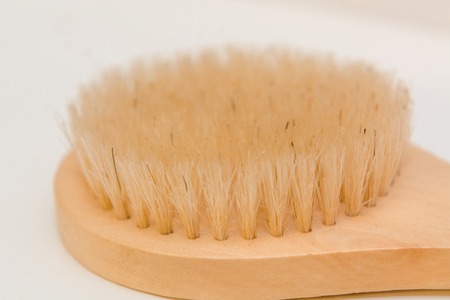 Clothes brush on the table. Clothing brush. Brush for cleaning.の写真素材