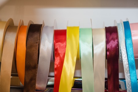 Bright decorative ribbons. Silk ribbons for gift wrapping. Colorful multi-colored ribbons for packaging. Festive attributesの写真素材