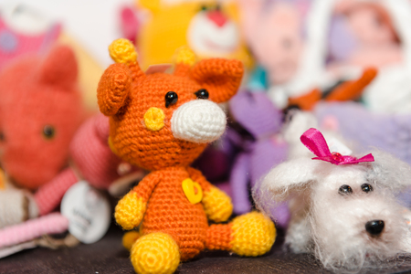 Knitted children's toys. Hand-made toys as a gift. Designer fun stuff. Homemade creativity. Hobbies and hobbiesの写真素材