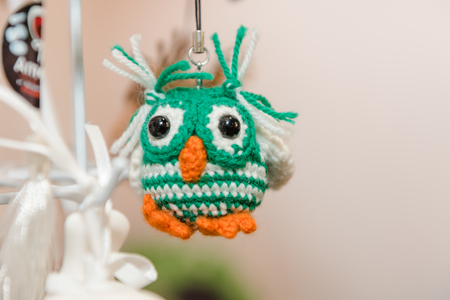 Knitted children's toys. Hand-made toys as a gift. Designer fun stuff. Homemade creativity. Hobbies and hobbiesの写真素材