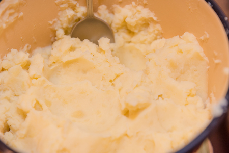 Smash potatoes. Make mashed potatoes. Cooking at home. Natural productsの写真素材