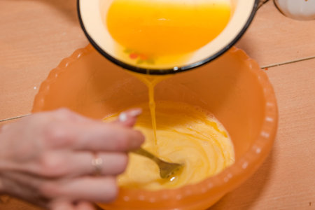 The girl kneads the dough. Home cooking. Mix the ingredients for the test. Natural food. Cooking