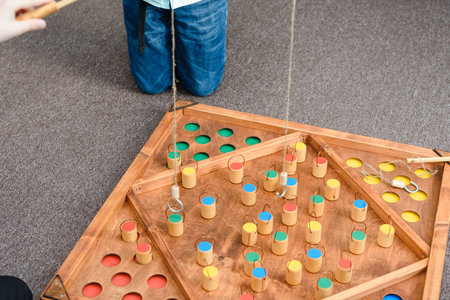 Kids games with colored shapes. Catch a wooden figure on the bait. Place the figures in places....