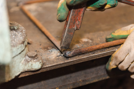 Work with welding in the carpentry shop. Weld metal parts. Dangerous industry. Sparks fly.