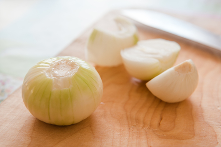 Onions sliced into rings. Natural food. Salad dressing. Onions on the table.の写真素材