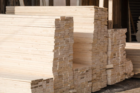 Logs sawn on the boards. Sawing boards. A lot of lumber. Lumber warehouse