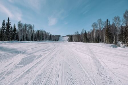 Snow slope in snowy mountain.の写真素材