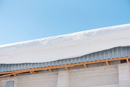Large snow drift on the roof.の写真素材