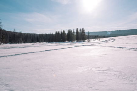 Village in the winter. Houses in Siberia under the snow. Buildings in the snow. Countryside in...