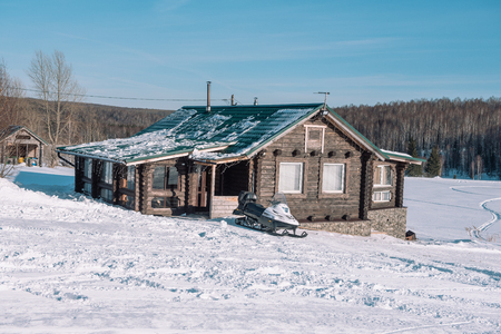 Village in the winter. Houses in Siberia under the snow. Buildings in the snow. Countryside in winter. Winter resortの写真素材