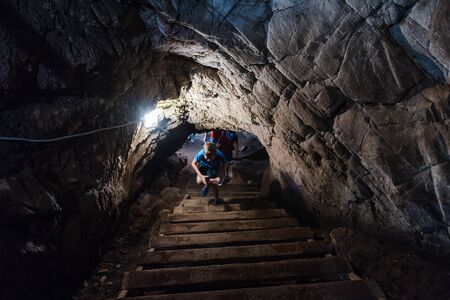 stone caves. caves in the mountains. visit the tour. leisure. large stones underground. tunnels in the mountains. stone tunnels. be undergroundの写真素材