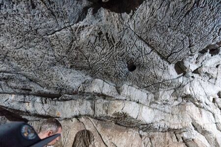 stone caves close up. big stones. stones underground. excursions in mountain caves. stone ledges. sharp stones.の写真素材