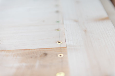 Screws in a board. many screws in the board. shield from the boards. home repairs.の写真素材