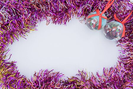 Christmas background. Christmas tinsel on a white background. Colored tinselの写真素材