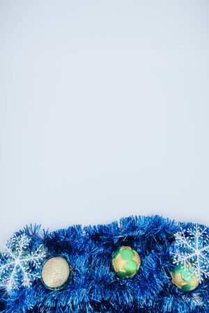 Christmas background. Christmas tinsel on a white background. Colored tinselの写真素材