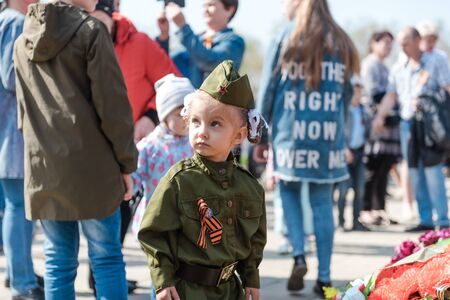 Zarinsk, Russia - May 9, 2019: people lay flowers on Victory Day. Laying flowers on the eternal flame of May 9. Victory Dayのeditorial素材