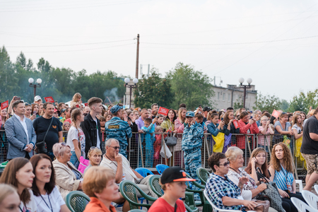 Zarinsk, Russia - July 22, 2019: A huge crowd of people stands on the square. Crowdのeditorial素材