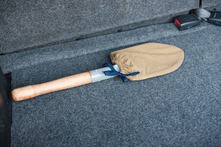 The blade lies in the car. Tool. Dig with a shovel. Dig out the car. Seasons. The weather is different. Lying in a carの写真素材
