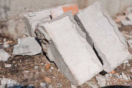 Scrap bricks. Construction is in progress. Destroy a brick wall. Engage in construction. Bricks with cement. Construction Materialsの写真素材