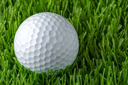 A golf ball on an artificial turf. Screen Golfの写真素材