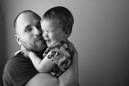 BW portrait of father playing with his daughter.の写真素材