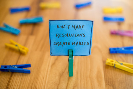 Dont make resolutions create habits - word concept on cubeの写真素材