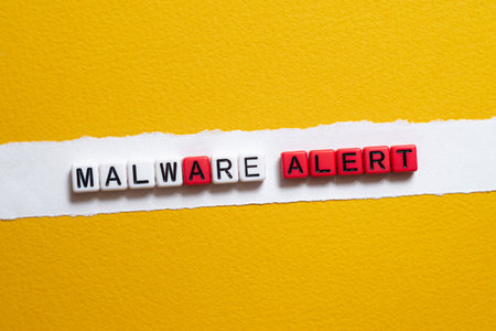 Malware alert - word concept on cubes, text, lettersの写真素材
