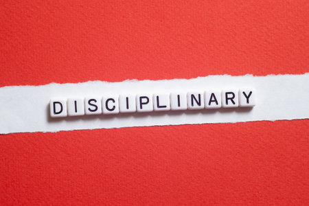 Disciplinary - word concept on cubes, text, lettersの写真素材