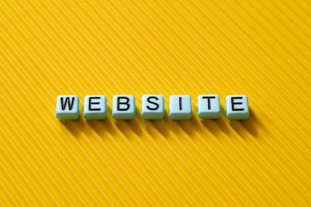 Website - word concept on cubes, text, lettersの写真素材