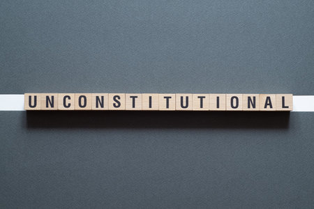 Unconstitutional - word concept on cubes, text, lettersの写真素材