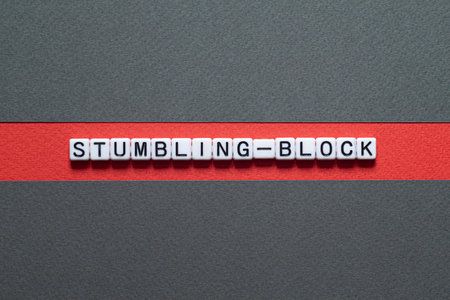 Stumbling-block - word concept on cubes, text, lettersの写真素材