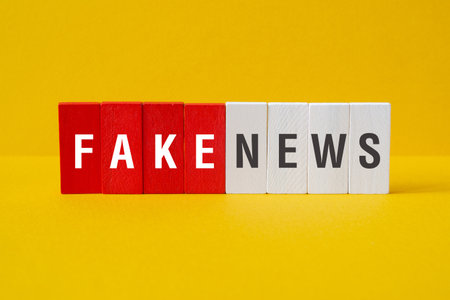 Fake news - word concept on building blocks, textの写真素材