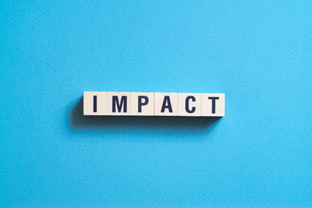 Impact - word concept on cubes, text, lettersの写真素材