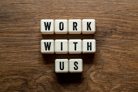 Work with us - word concept on building blocks, textの写真素材