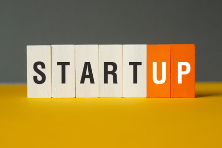 Startup - word concept on building blocks, textの写真素材
